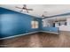 Spacious living room featuring modern flooring and ceiling fans at 219 E Valley View Dr, Phoenix, AZ 85042