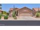 Attractive desert home with a two-car garage and drought-tolerant landscaping for easy maintenance at 2416 E Santiago Trl, Casa Grande, AZ 85194
