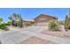Charming desert home, complete with a two-car garage and easy-care landscaping at 2416 E Santiago Trl, Casa Grande, AZ 85194