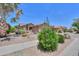Beautiful desert landscaping in front of this single-story home creates excellent curb appeal in this arid climate at 2416 E Santiago Trl, Casa Grande, AZ 85194