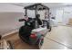 Garage featuring a golf cart, bike, and ample storage space for an active lifestyle at 2416 E Santiago Trl, Casa Grande, AZ 85194