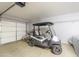 Spacious garage with a golf cart, bike, and ample room for storage and parking at 2416 E Santiago Trl, Casa Grande, AZ 85194