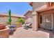 Cozy outdoor patio features comfortable seating and a charming bistro set, perfect for enjoying the beautiful weather at 2416 E Santiago Trl, Casa Grande, AZ 85194