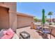Charming outdoor patio with cushioned seating, bistro set, and a peaceful ambiance for relaxing and enjoying the beautiful weather at 2416 E Santiago Trl, Casa Grande, AZ 85194
