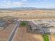 Serene aerial view of the neighborhood with desert landscape and mountain views at 24275 N 173Rd Ave, Surprise, AZ 85387