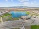 Great aerial view of the amenity center with pool, lake, and entertainment areas at 24275 N 173Rd Ave, Surprise, AZ 85387