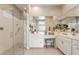 Bright bathroom featuring a walk-in shower, double sinks, vanity, and plenty of counter space at 24275 N 173Rd Ave, Surprise, AZ 85387