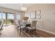 Dining area featuring wood flooring, sliding glass doors, and modern decor at 24275 N 173Rd Ave, Surprise, AZ 85387