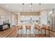 Kitchen featuring white cabinets, stainless steel appliances, and seating at the center island at 24275 N 173Rd Ave, Surprise, AZ 85387