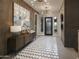 Stunning foyer showcasing modern decor, stylish lighting, and a striking geometric tiled floor at 24283 S 219Th Way, Queen Creek, AZ 85142