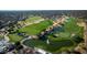 Overhead view of a lush golf course with a scenic pond and fountain in a community at 25286 N 156Th Ln, Surprise, AZ 85387