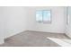 This bedroom offers soft carpeted floors and windows that bring in plenty of natural light at 25286 N 156Th Ln, Surprise, AZ 85387