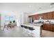 Bright kitchen with granite countertops, stainless steel appliances, and a dining area at 25286 N 156Th Ln, Surprise, AZ 85387
