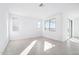Bright living room with multiple windows that bring in natural light and neutral-toned tile floors at 25286 N 156Th Ln, Surprise, AZ 85387