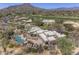 Aerial view of an estate with pool, patio, and built in BBQ overlooking gorgeous desert landscaping at 3119 Arroyo Hondo --, Carefree, AZ 85377