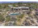 Gorgeous aerial view of a southwest home boasting a pristine pool and multiple patios at 3119 Arroyo Hondo --, Carefree, AZ 85377