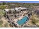 Gorgeous aerial view of a southwest home boasting a pristine pool and multiple patios at 3119 Arroyo Hondo --, Carefree, AZ 85377