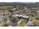 Stunning aerial view of a modern home with a backyard pool, lush landscaping, and desert surroundings at 3119 Arroyo Hondo --, Carefree, AZ 85377