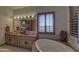 Beautiful bathroom featuring dual sinks, tub, and many windows bringing natural light into the space at 3119 Arroyo Hondo --, Carefree, AZ 85377