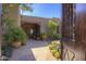 Inviting courtyard featuring desert landscaping, potted plants, and wooden beamed covering over the entryway at 3119 Arroyo Hondo --, Carefree, AZ 85377