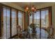 Small dining area featuring a chandelier and shuttered windows, creating a cozy and bright space at 3119 Arroyo Hondo --, Carefree, AZ 85377