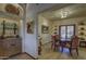 Elegant dining room with niche shelving, a small wet bar, a dark wood table and four upholstered chairs at 3119 Arroyo Hondo --, Carefree, AZ 85377