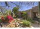 Desert landscape features a stream with waterfall, cactus, and mature trees surrounding the hacienda-style home at 3119 Arroyo Hondo --, Carefree, AZ 85377