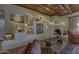 Cozy living room featuring a stucco fireplace, wood ceiling and decorative Southwestern accents at 3119 Arroyo Hondo --, Carefree, AZ 85377