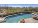 Backyard pool surrounded by desert landscape, offering a refreshing escape with scenic views at 3119 Arroyo Hondo --, Carefree, AZ 85377