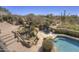 Luxury backyard with a pool, spa, and rock water feature, ideal for relaxation and outdoor enjoyment at 3119 Arroyo Hondo --, Carefree, AZ 85377