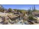 Backyard water feature and spa, offering a tranquil retreat with natural stone accents and desert flora at 3119 Arroyo Hondo --, Carefree, AZ 85377