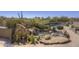 Backyard oasis with a serene rock water feature, offering a tranquil escape within the property at 3119 Arroyo Hondo --, Carefree, AZ 85377