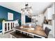 The kitchen and dining area featuring an open floorplan and stylish modern lighting at 34210 N Beeblossom Trl, San Tan Valley, AZ 85144