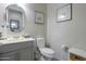 Bathroom featuring a round mirror and gray vanity at 391 N San Ricardo Trl, Casa Grande, AZ 85194