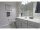 Bathroom with a gray vanity, gray towels, and white tile flooring at 391 N San Ricardo Trl, Casa Grande, AZ 85194