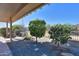 Covered patio shows desert landscaping and provides a shaded spot for outdoor relaxation and enjoying the view at 391 N San Ricardo Trl, Casa Grande, AZ 85194