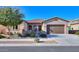 Charming single-story home featuring a stone-accented entry, tile roof, and well-maintained landscaping at 391 N San Ricardo Trl, Casa Grande, AZ 85194