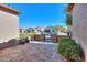 Landscaped front yard with a stone-accented wall and gate, offering a glimpse of the neighborhood at 391 N San Ricardo Trl, Casa Grande, AZ 85194