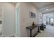 Inviting hallway with stylish decor, including a console table and decorative vases at 391 N San Ricardo Trl, Casa Grande, AZ 85194