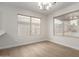 Bright dining room boasting sleek floors, natural light and neutral walls at 4053 W Quail Ave, Glendale, AZ 85308