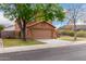 Two-story home with a spacious driveway, two-car garage and mature shade trees at 4053 W Quail Ave, Glendale, AZ 85308