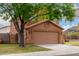 Attractive home with a two-car garage and lush front yard landscaping at 4053 W Quail Ave, Glendale, AZ 85308