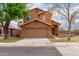 Inviting two-story home featuring a tidy lawn and a convenient two-car garage at 4053 W Quail Ave, Glendale, AZ 85308