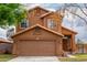 Charming two-story home with a well-maintained front yard and a two-car garage at 4053 W Quail Ave, Glendale, AZ 85308