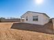 Wide view of the spacious backyard on a sunny day at 41740 W Sonoran Trl, Maricopa, AZ 85138