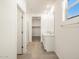 Bright bathroom featuring a double vanity, tiled floors, and a glass-enclosed shower at 41740 W Sonoran Trl, Maricopa, AZ 85138