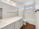 Bathroom featuring white cabinets and vanity, sink, and a shower-tub combo with tile surround at 4360 E Sierrita Rd, San Tan Valley, AZ 85143