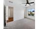 Carpeted bedroom with a ceiling fan and natural light offers a comfortable retreat at 4360 E Sierrita Rd, San Tan Valley, AZ 85143