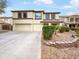 Charming two-story home featuring a two-car garage, well maintained landscaping, and a welcoming entrance at 4360 E Sierrita Rd, San Tan Valley, AZ 85143