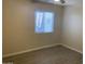 Neutral bedroom features new flooring and window at 607 W 14Th St, Tempe, AZ 85281